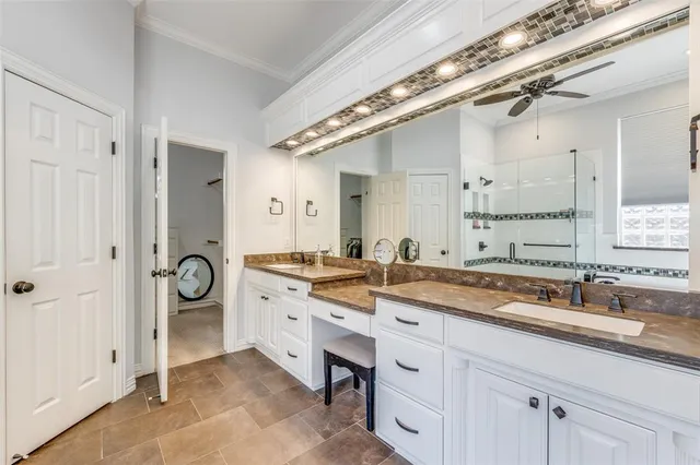 a spacious bathroom with a granite countertop sink a mirror and a