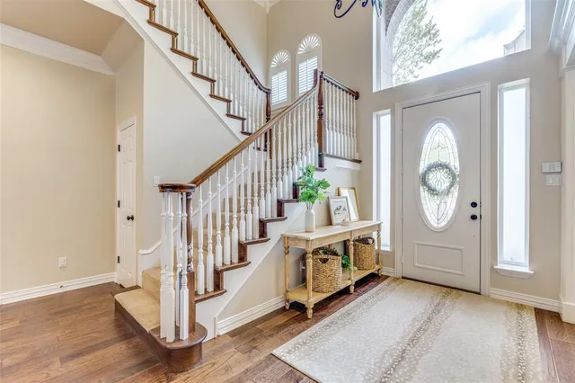 a view of an entryway with wooden floor