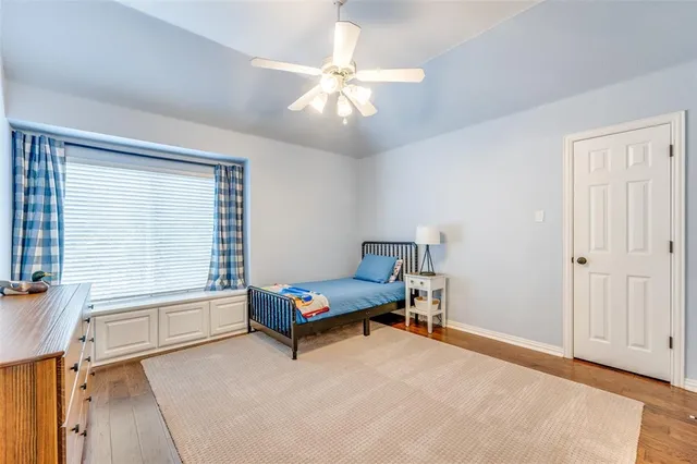 a bedroom with furniture and a window
