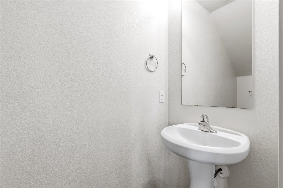 19808 Hubert R Humphrey Road Manor, TX 78653 - Photo 30 of 37 A well-appointed lavatory offers convenient amenities within this functional space.