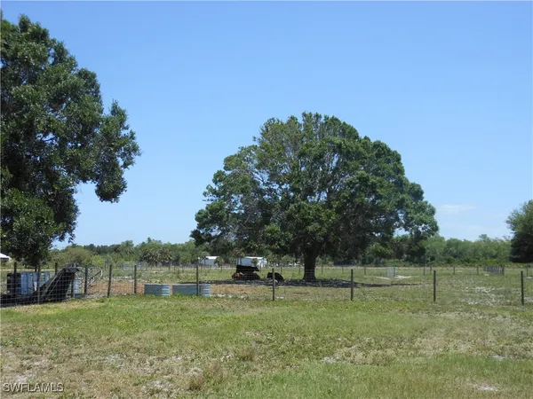 a view of outdoor space with deck and yard