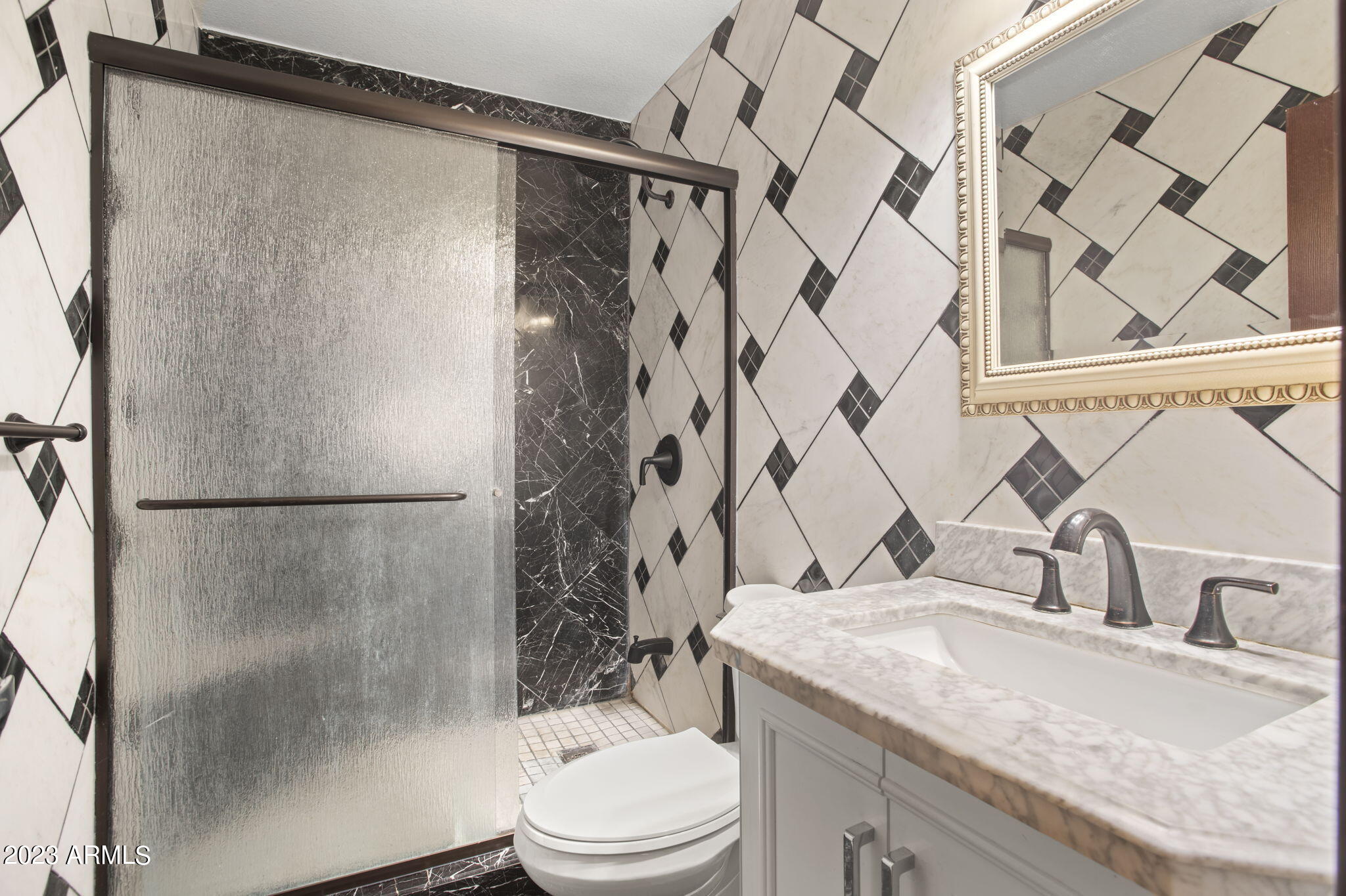 7775 North 52nd Drive Glendale, AZ 85301 - Photo 19 of 51 a bathroom with a granite countertop shower toilet and sink