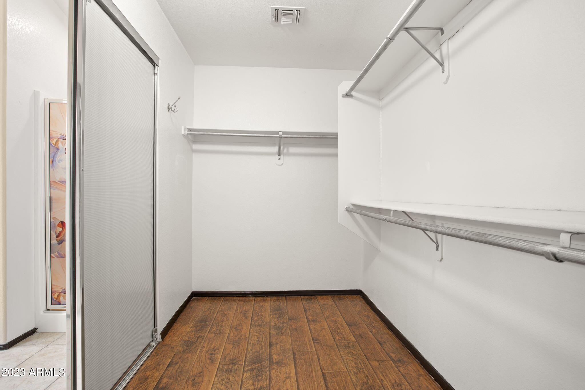 7775 North 52nd Drive Glendale, AZ 85301 - Photo 29 of 51 a view of walk in closet with empty racks