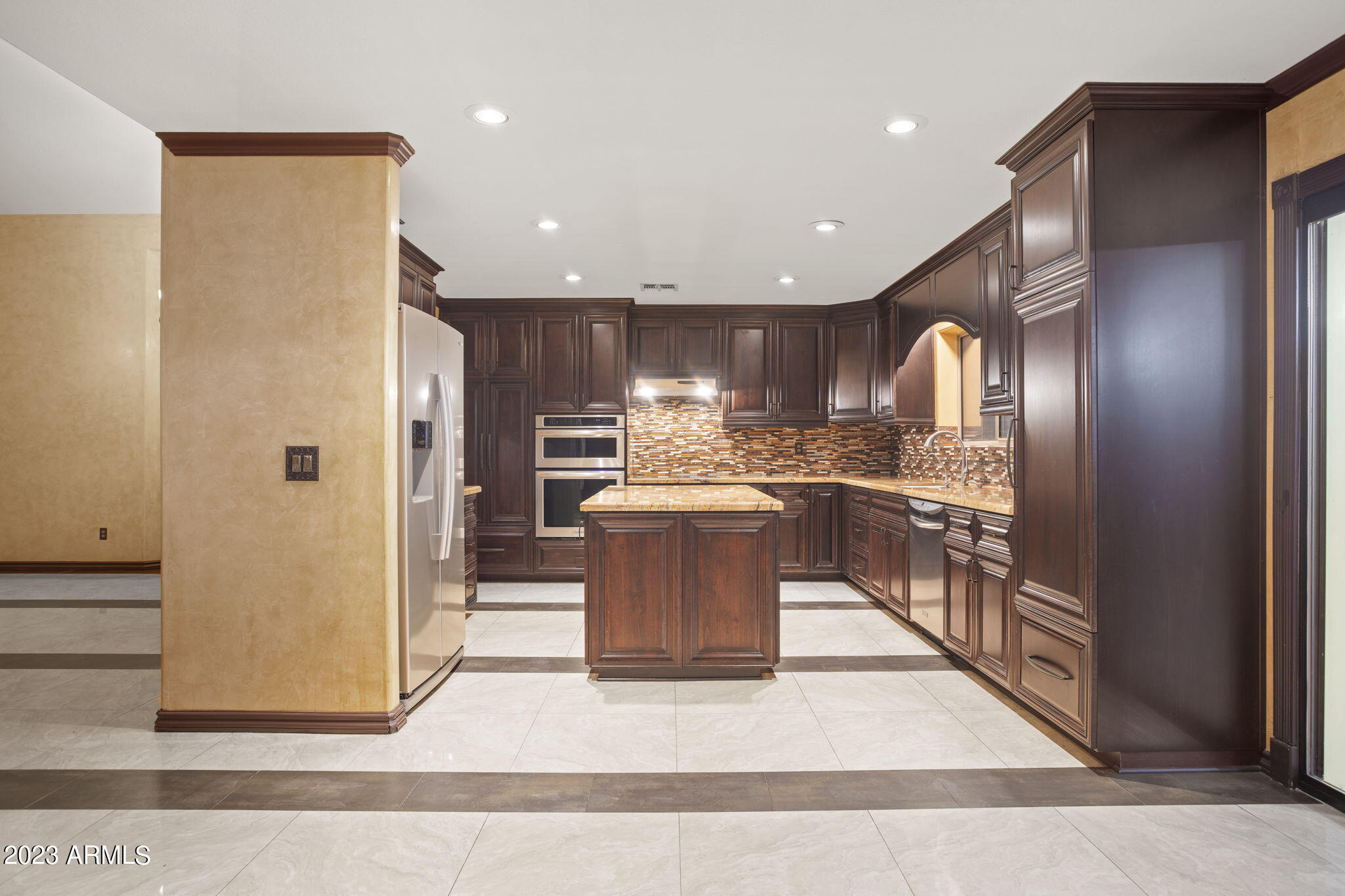 7775 North 52nd Drive Glendale, AZ 85301 - Photo 7 of 51 a kitchen with stainless steel appliances granite countertop a refrigerator a sink a stove and a refrigerator