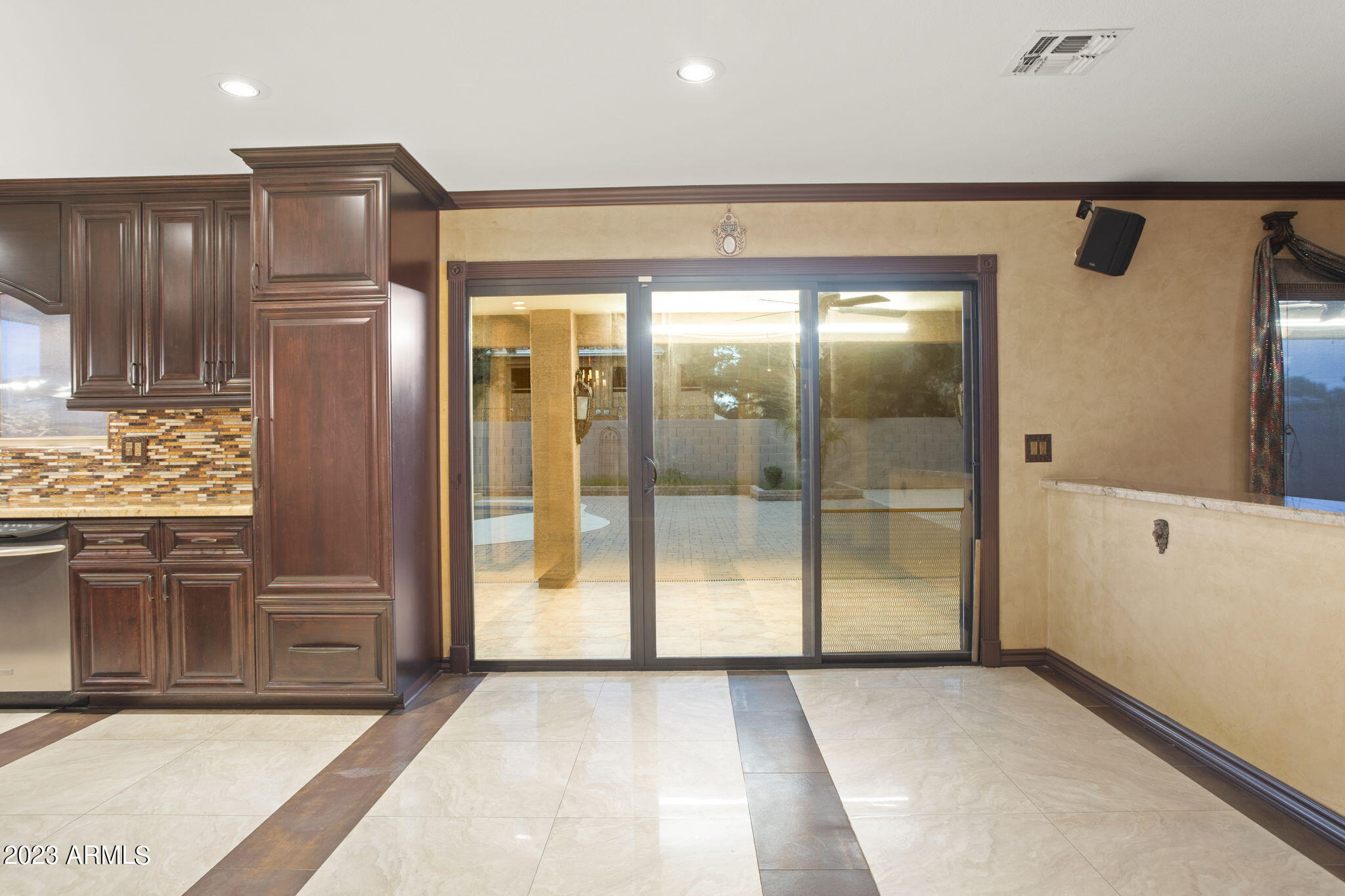7775 North 52nd Drive Glendale, AZ 85301 - Photo 8 of 51 a view of a hallway with wooden cabinets