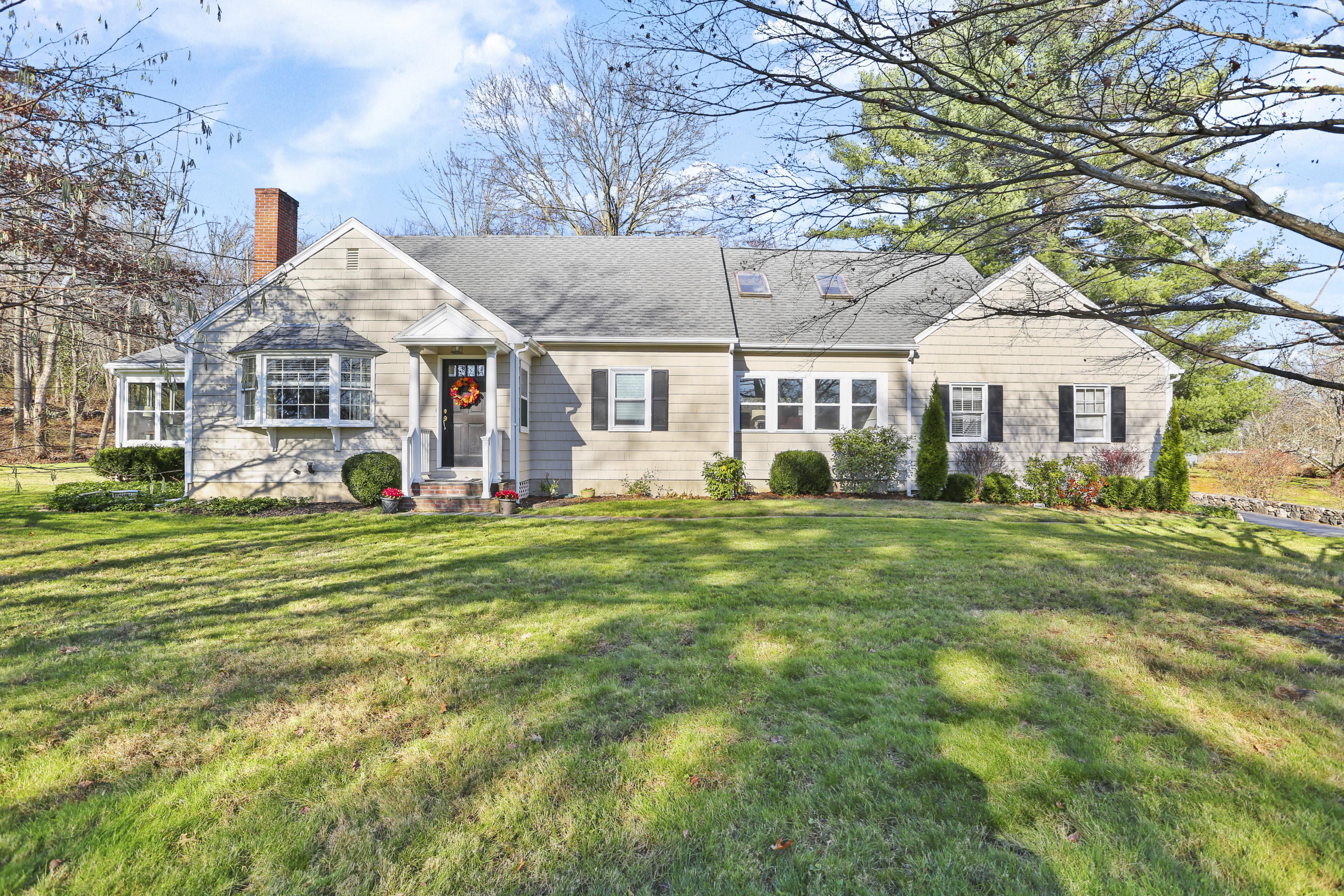 10 Stephen Mather Road Norwalk, CT 06850 - Photo 1 of 29 a front view of a house with a garden and trees