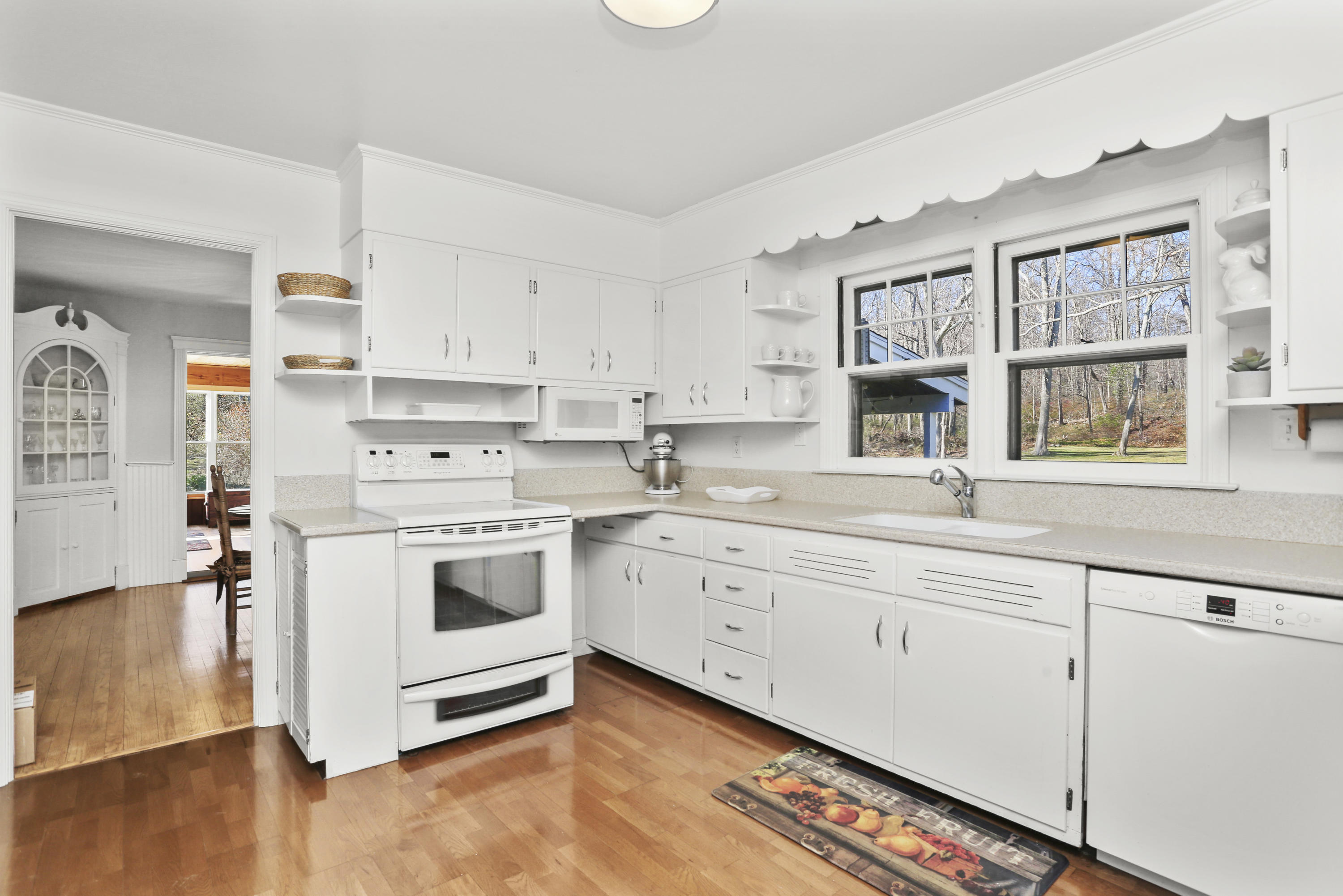 10 Stephen Mather Road Norwalk, CT 06850 - Photo 13 of 29 a kitchen with granite countertop white cabinets and white appliances