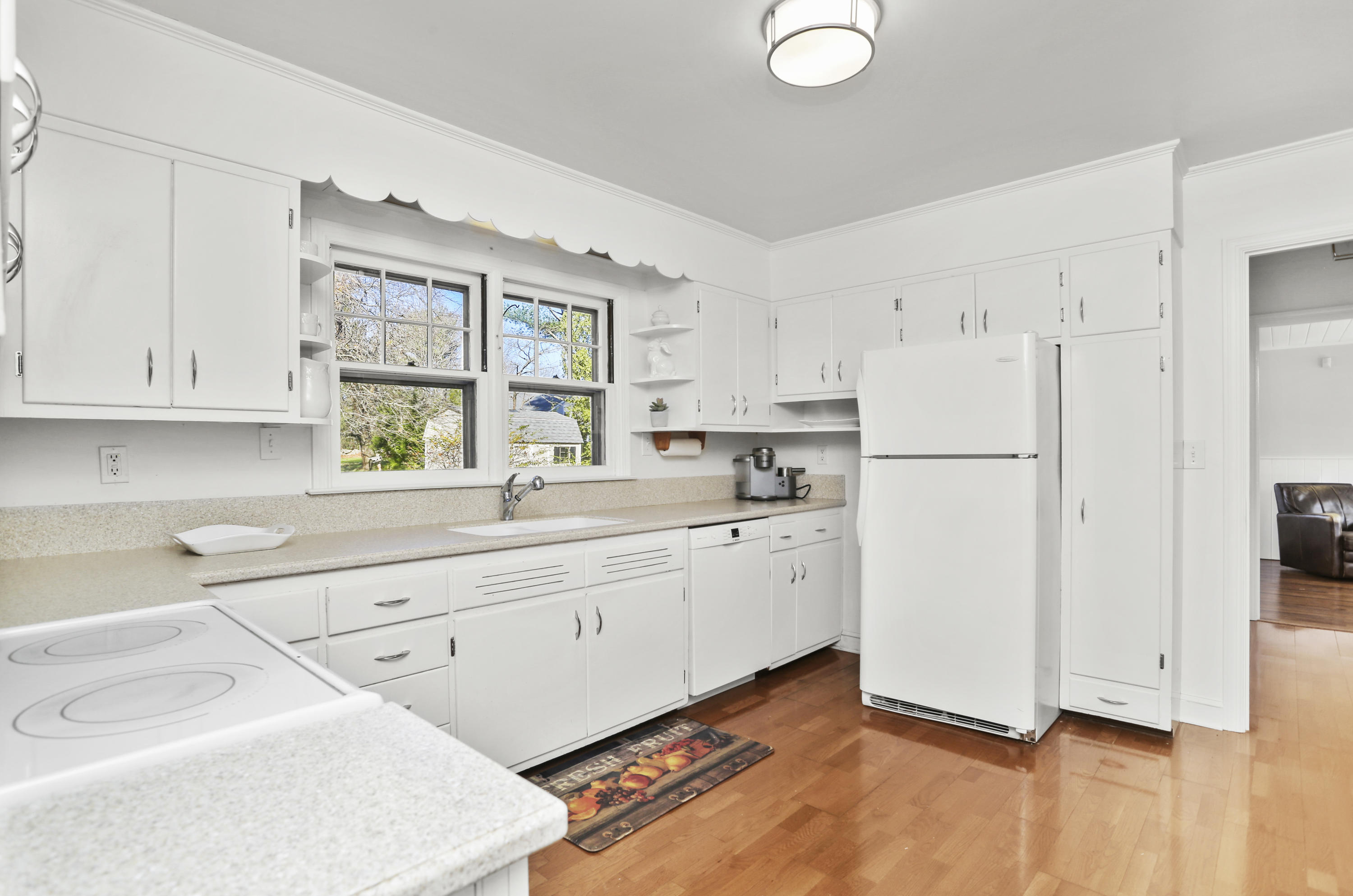 10 Stephen Mather Road Norwalk, CT 06850 - Photo 15 of 29 a kitchen with white cabinets and white appliances