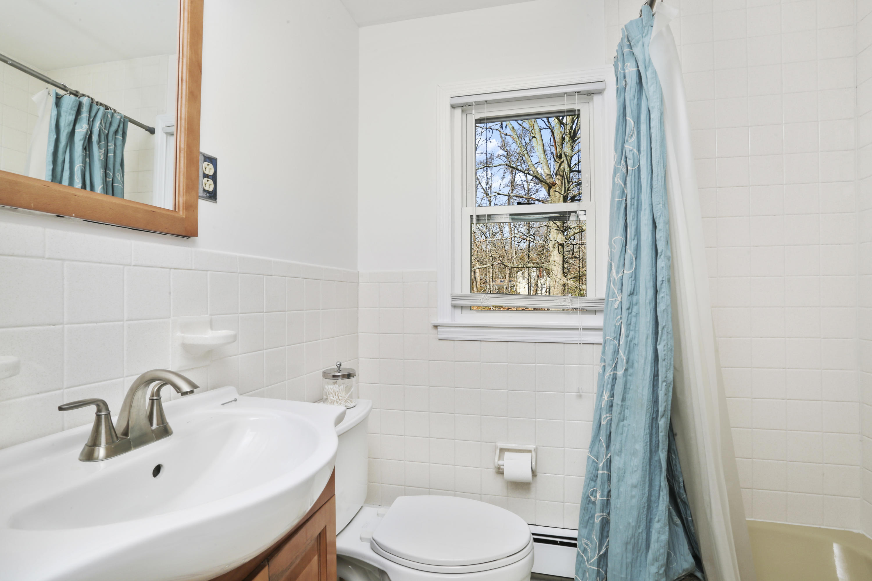 10 Stephen Mather Road Norwalk, CT 06850 - Photo 21 of 29 a bathroom with a sink mirror and toilet