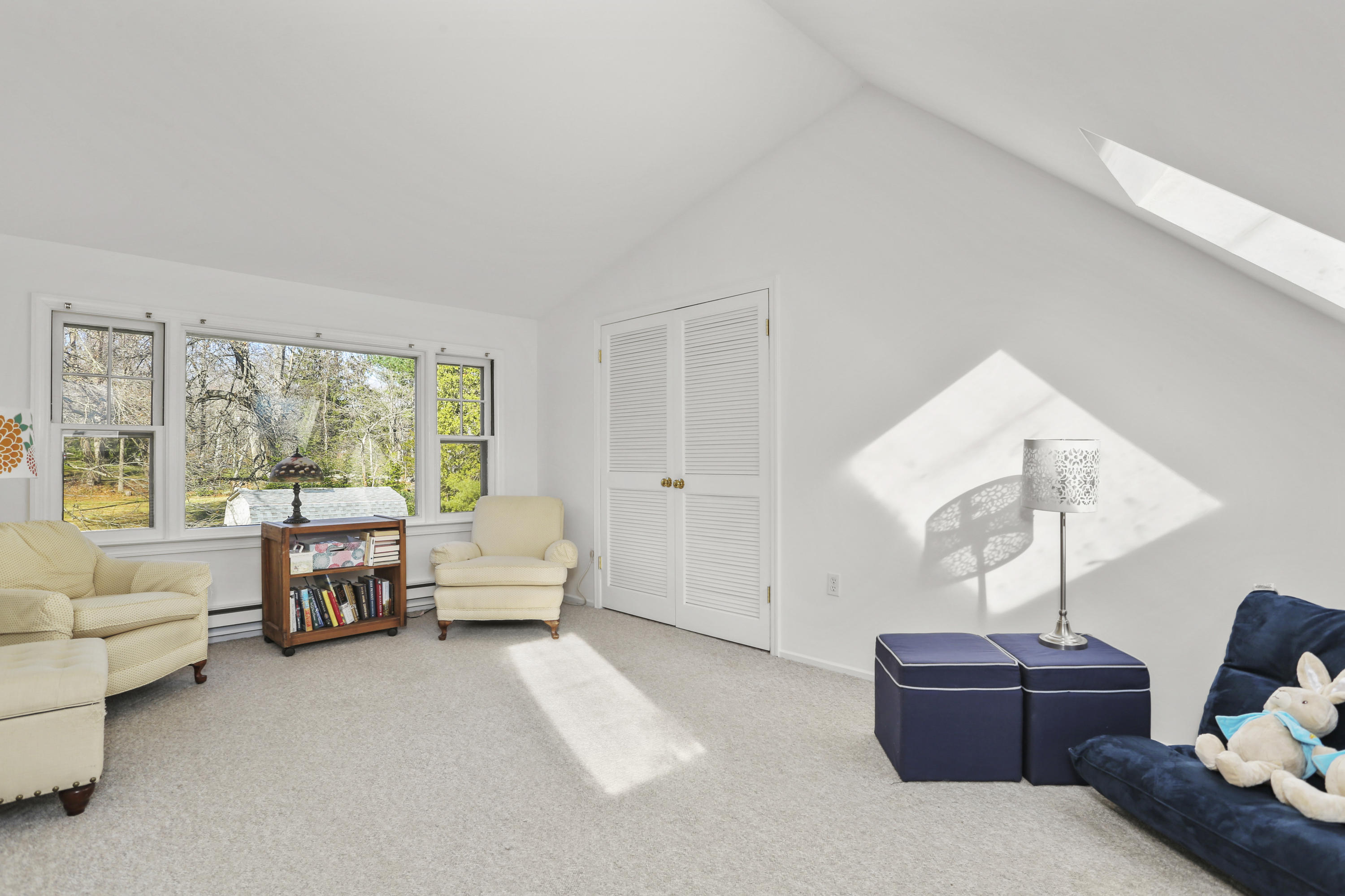 10 Stephen Mather Road Norwalk, CT 06850 - Photo 23 of 29 a living room with furniture and a large window