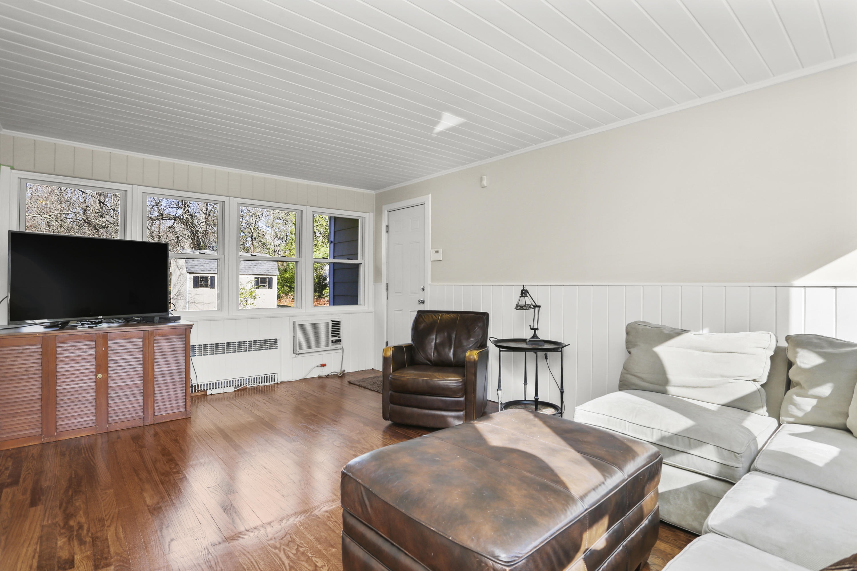10 Stephen Mather Road Norwalk, CT 06850 - Photo 26 of 29 a living room with furniture and a flat screen tv