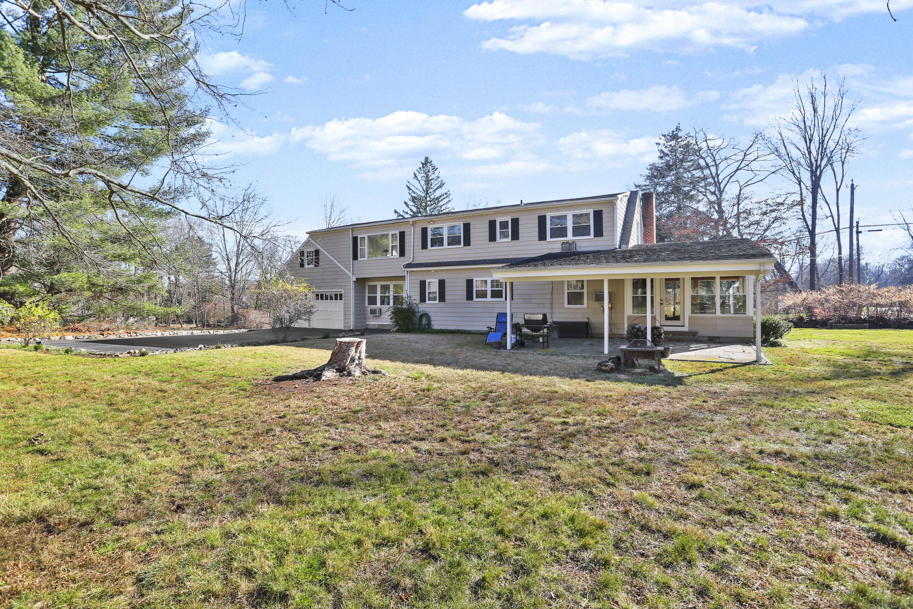 10 Stephen Mather Road Norwalk, CT 06850 - Photo 4 of 29 a view of a house with swimming pool and sitting area