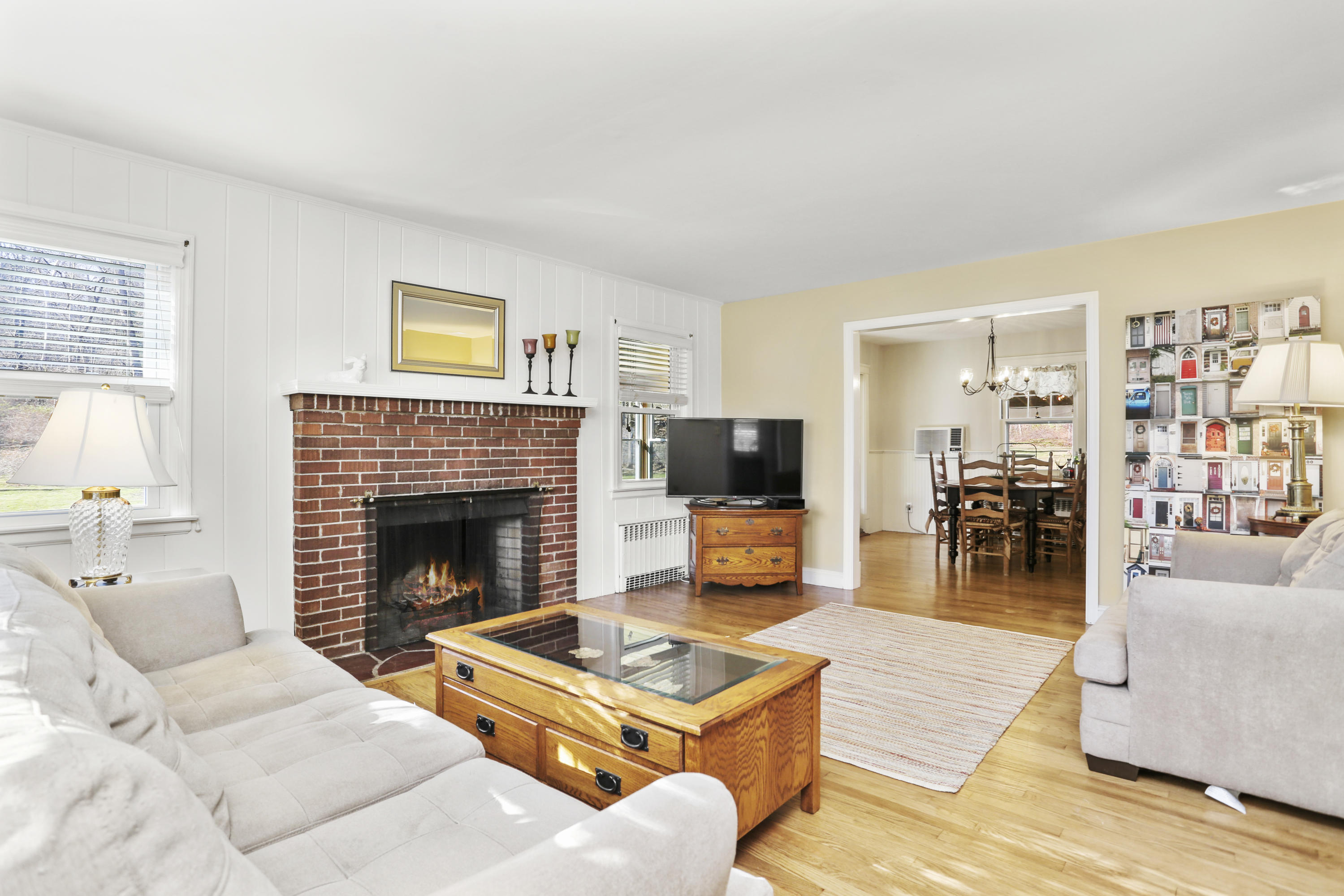 10 Stephen Mather Road Norwalk, CT 06850 - Photo 8 of 29 a living room with furniture and a fireplace