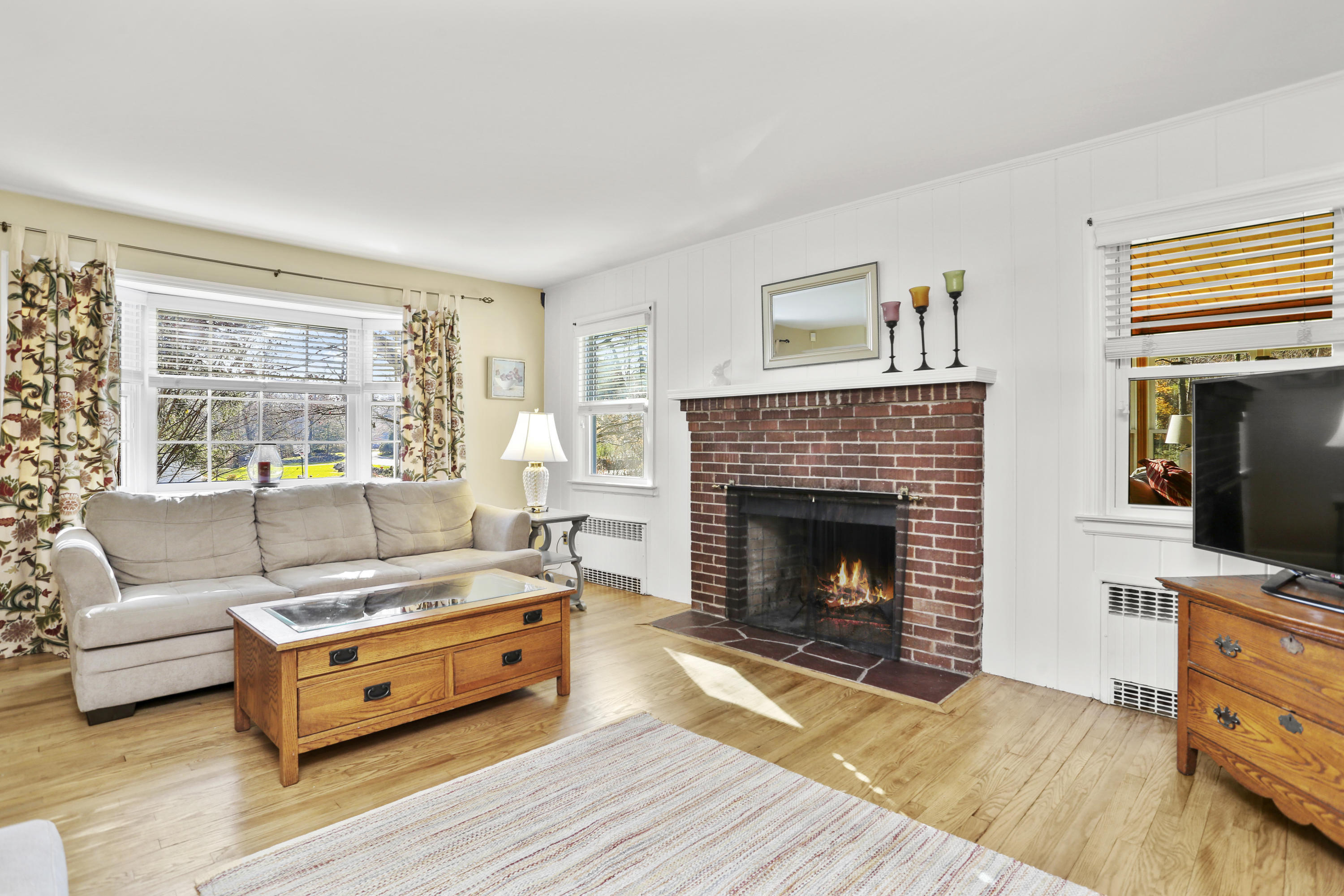 10 Stephen Mather Road Norwalk, CT 06850 - Photo 9 of 29 a living room with furniture and a fireplace