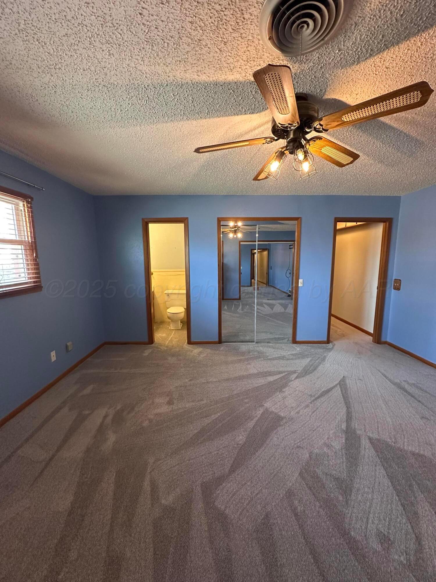 1007 Archer Street Spearman, TX 79081 - Photo 12 of 20 a view of an empty room with window