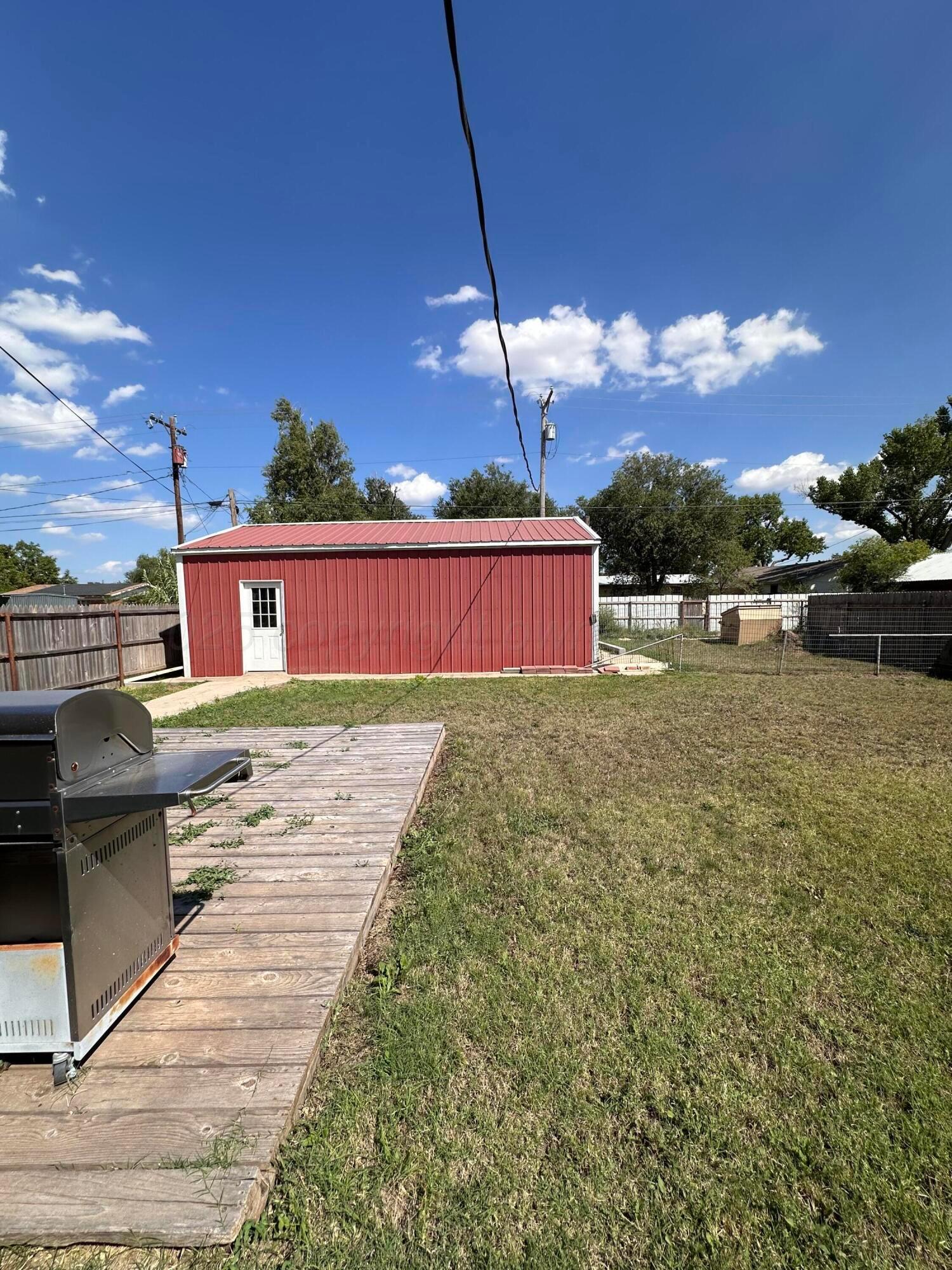 1007 Archer Street Spearman, TX 79081 - Photo 16 of 20 a view of a house with a swimming pool