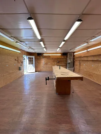 a view of a kitchen with a sink and a microwave