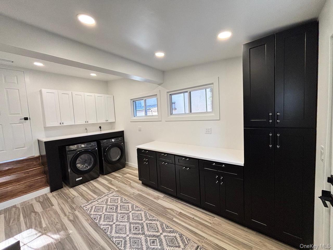 791 Longview Avenue Valley Stream, NY 11581 - Photo 18 of 33 Laundry room with cabinet space, separate washer and dryer, light wood-style floors, and recessed lighting
