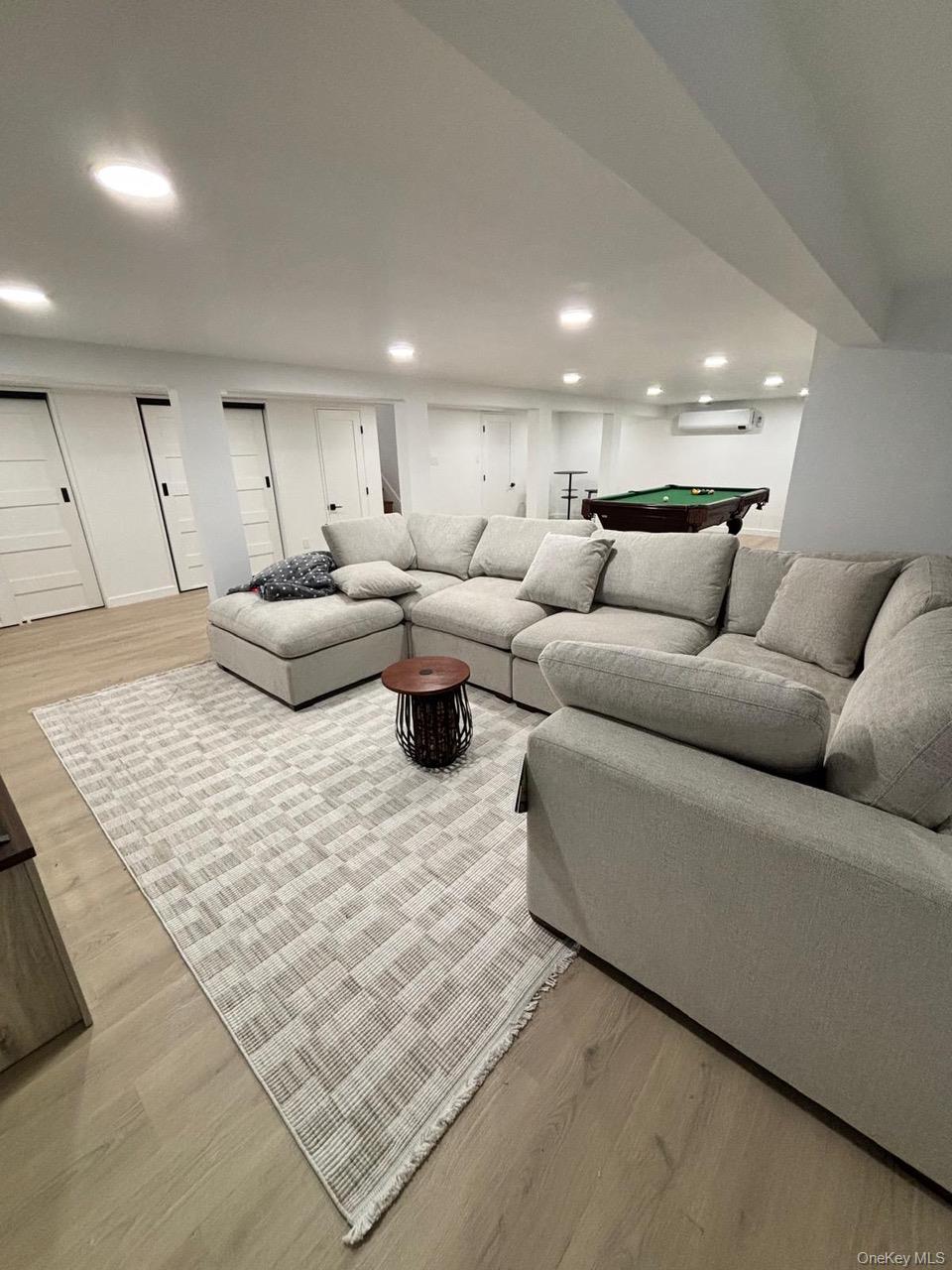 791 Longview Avenue Valley Stream, NY 11581 - Photo 21 of 33 Living room with light wood finished floors, recessed lighting, and billiards table