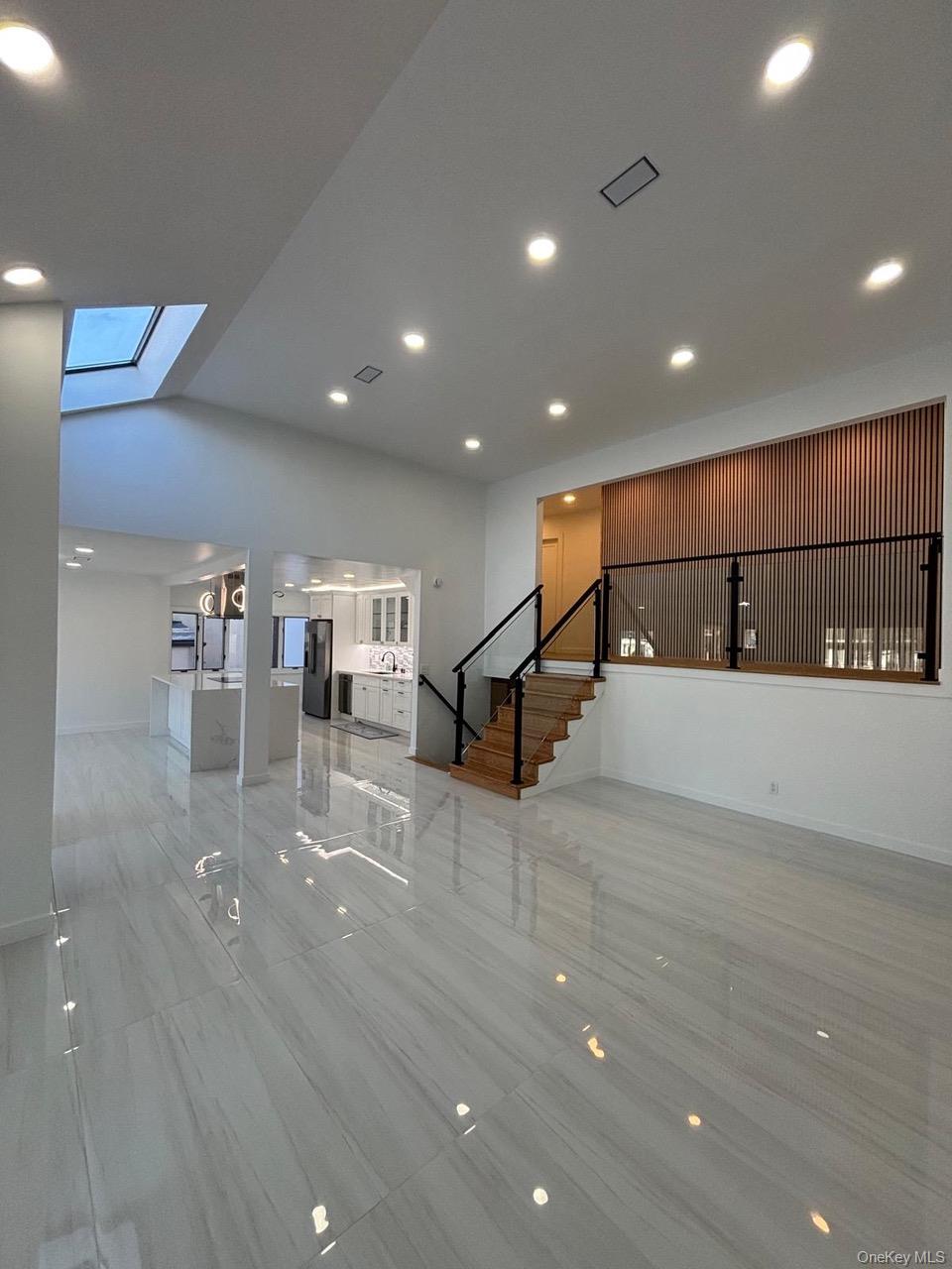 791 Longview Avenue Valley Stream, NY 11581 - Photo 22 of 33 Unfurnished living room featuring recessed lighting and a skylight