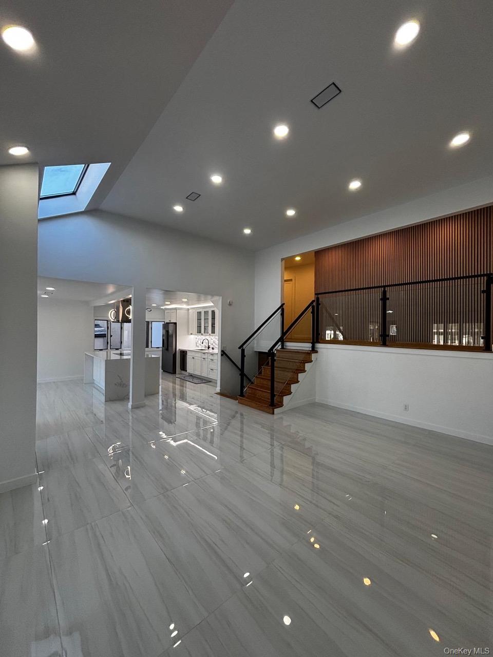 791 Longview Avenue Valley Stream, NY 11581 - Photo 10 of 33 Unfurnished living area featuring recessed lighting and a skylight