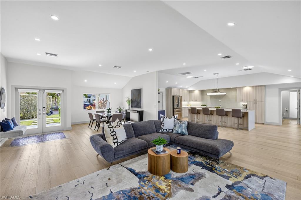 5215 Seashell Avenue Naples, FL 34103 - Photo 13 of 47 a living room with furniture and wooden floor