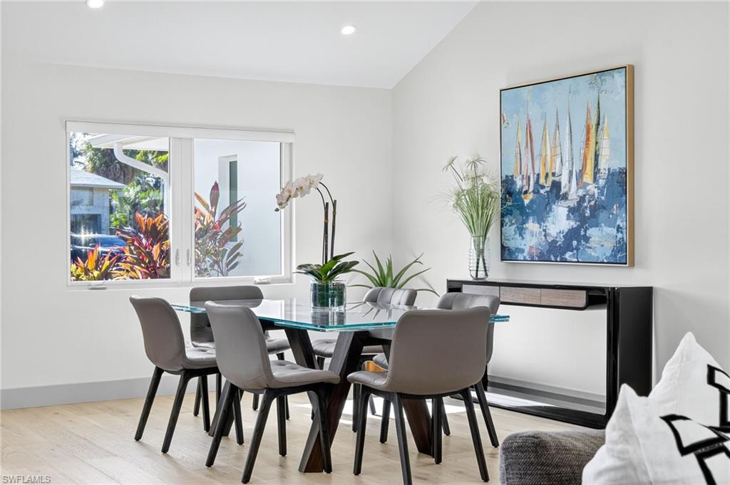 5215 Seashell Avenue Naples, FL 34103 - Photo 16 of 47 a dining room with furniture and window