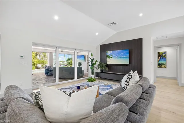a kitchen with stainless steel appliances kitchen island granite countertop a table and chairs