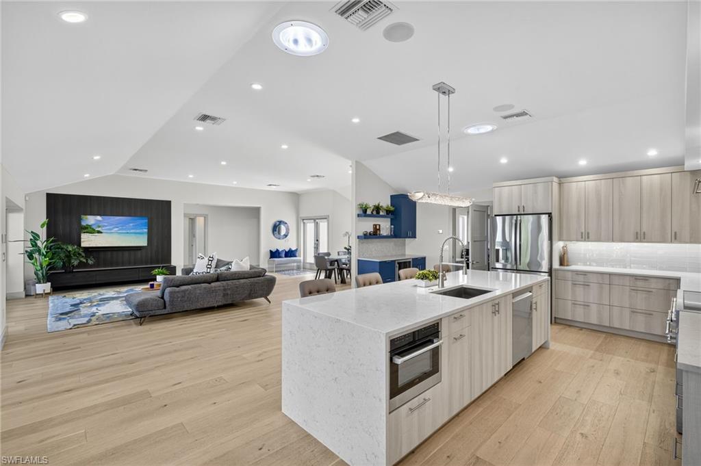 5215 Seashell Avenue Naples, FL 34103 - Photo 23 of 47 a large kitchen with stainless steel appliances lots of counter top space