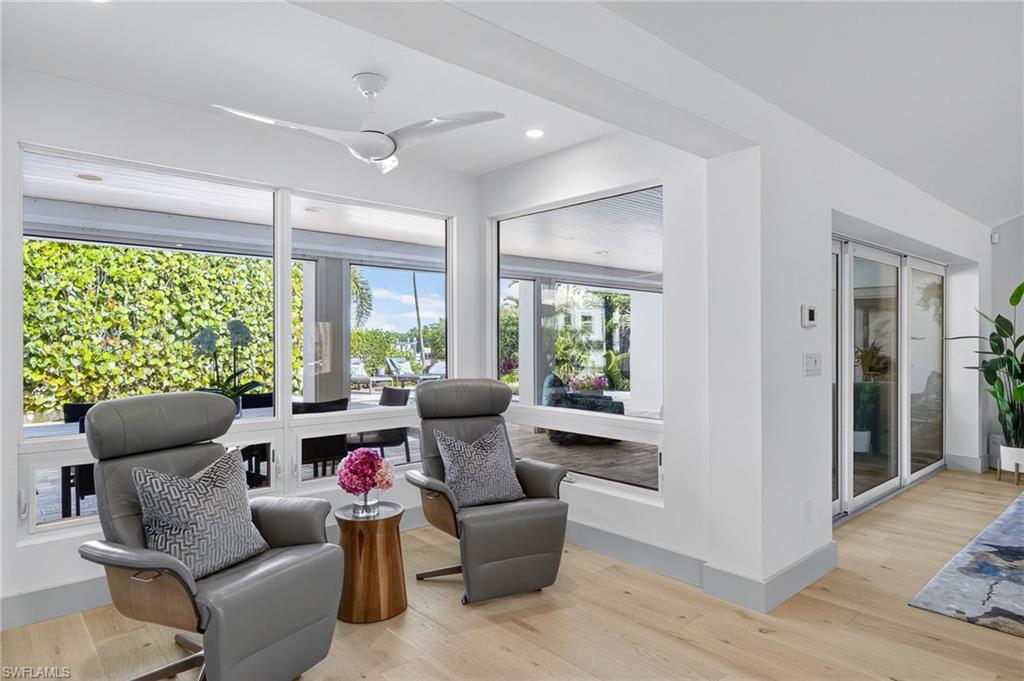 5215 Seashell Avenue Naples, FL 34103 - Photo 28 of 47 a living room with furniture and a large window