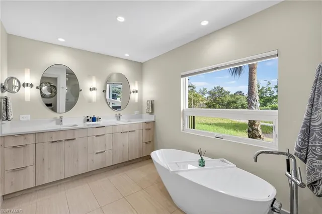 a bathroom with a granite countertop sink a toilet and shower