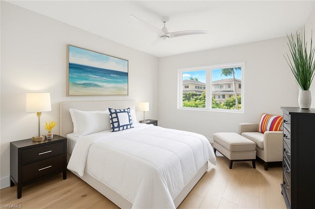 5215 Seashell Avenue Naples, FL 34103 - Photo 35 of 47 a bedroom with a bed and a window