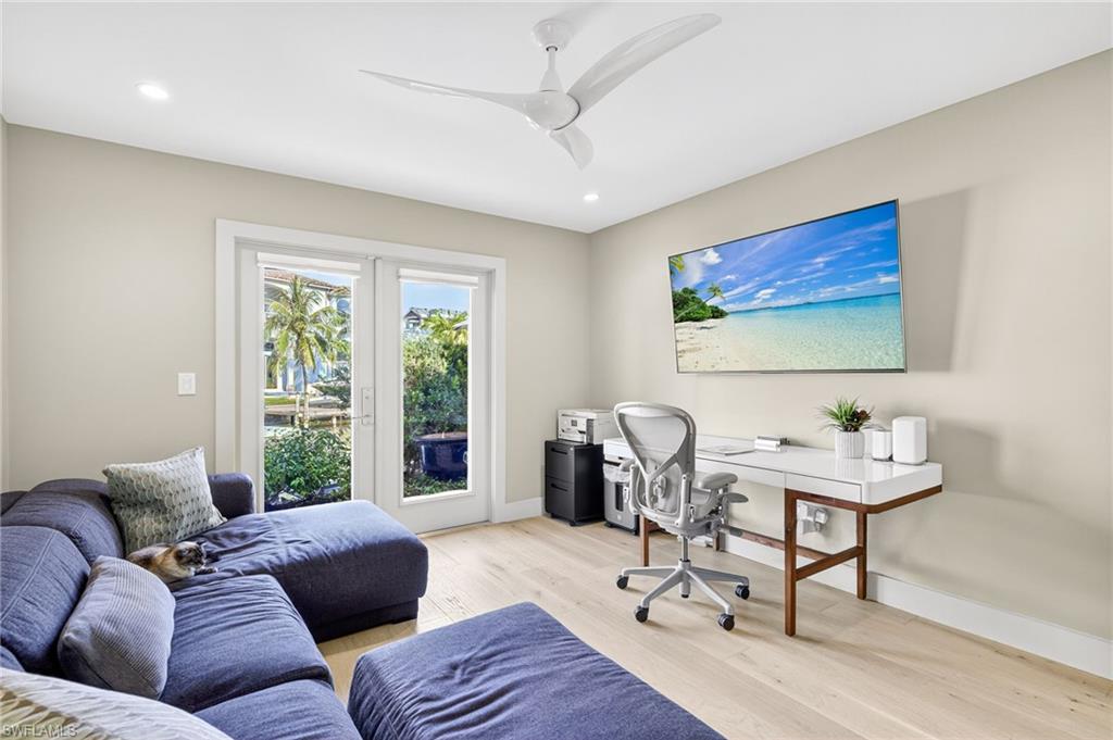 5215 Seashell Avenue Naples, FL 34103 - Photo 37 of 47 a living room with furniture and a window