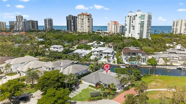 a view of a swimming pool with some potted plants
