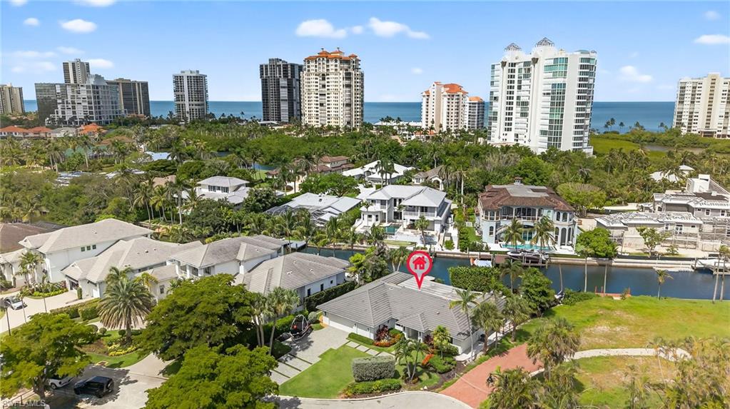 5215 Seashell Avenue Naples, FL 34103 - Photo 46 of 47 a view of city and a tall buildings