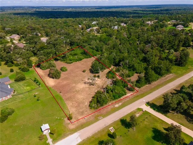 a view of a yard with an outdoor seating