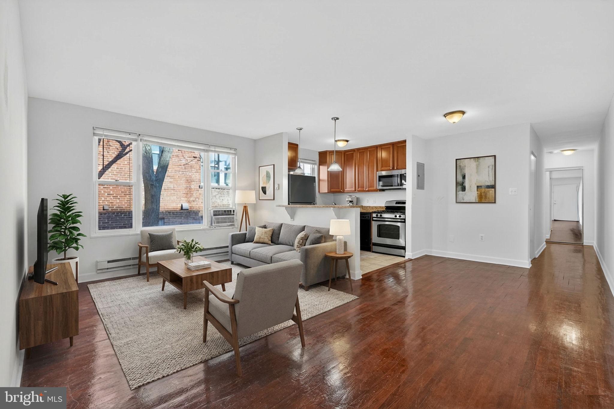 2523 13th Street Northwest, Unit 103 Washington, DC 20009 - Photo 5 of 29 a living room with fireplace furniture and a wooden floor