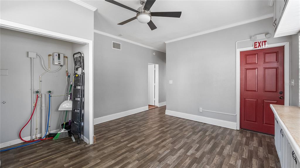 1704 West Main Street Leesburg, FL 34748 - Photo 22 of 37 a view of a hallway with closet and wooden floor