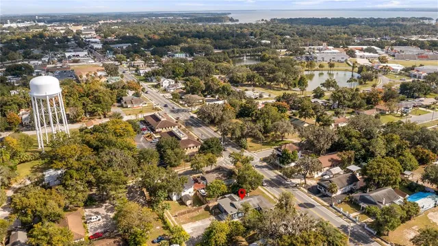 an aerial view of residential houses with city view