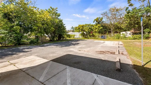 a view of a backyard of the house