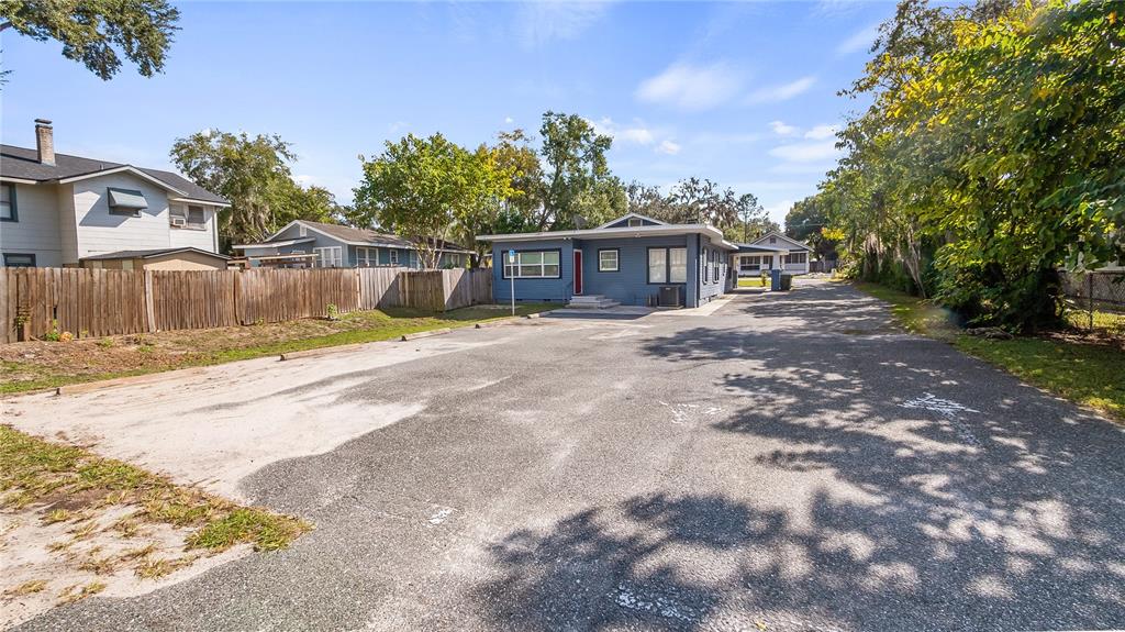 1704 West Main Street Leesburg, FL 34748 - Photo 5 of 37 a view of a house with a yard