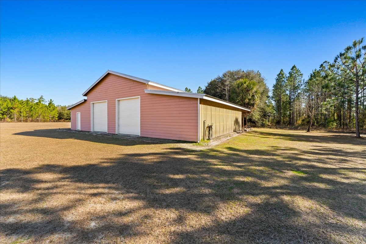 27247 Hallman Road Hilliard, FL 32046 - Photo 12 of 59 a view of a house with a swimming pool