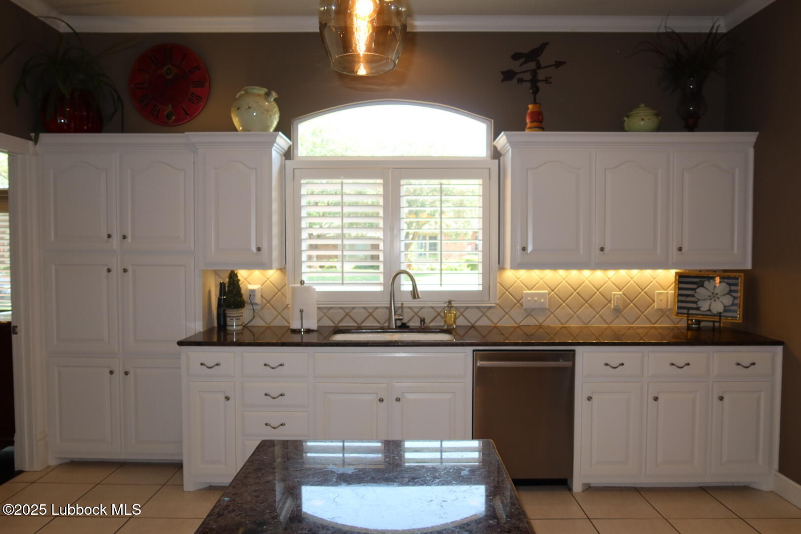 4807 101st Street Lubbock, TX 79424 - Photo 11 of 44 a kitchen that has a sink and a stove