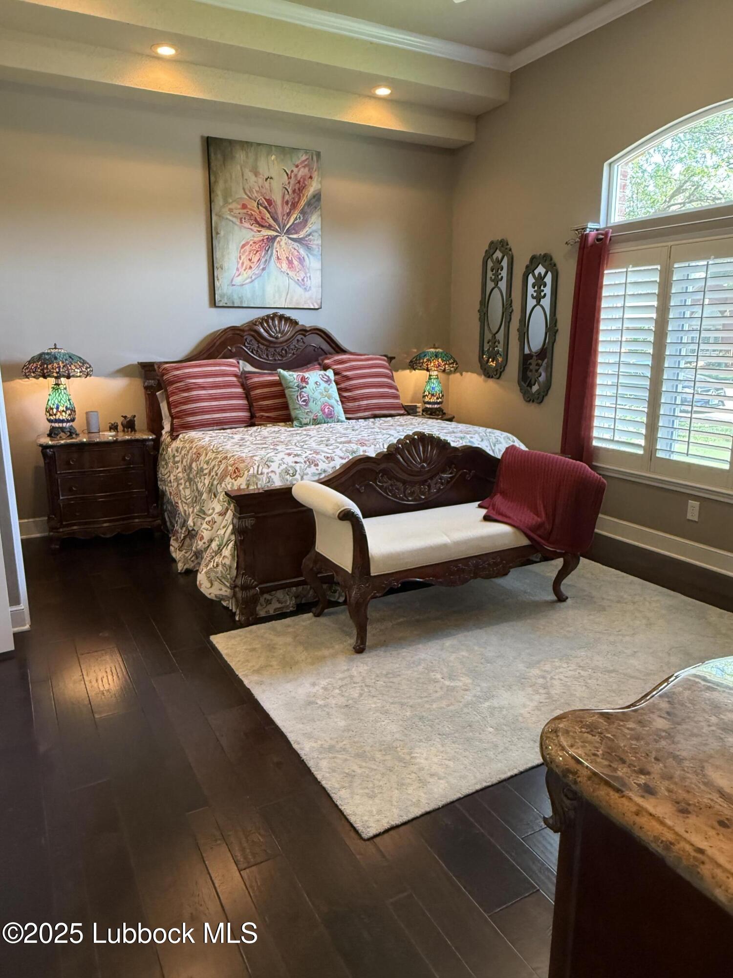 4807 101st Street Lubbock, TX 79424 - Photo 15 of 44 a bedroom with a bed and window