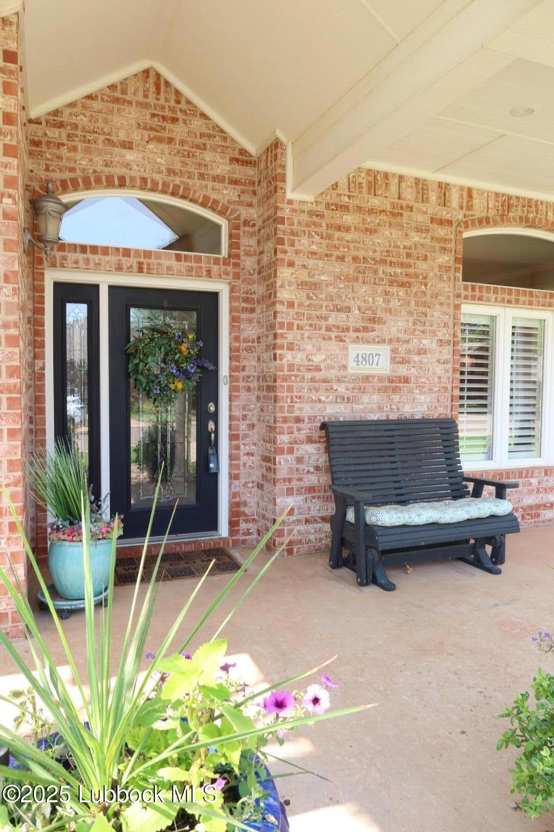 4807 101st Street Lubbock, TX 79424 - Photo 2 of 44 a bench is sitting in front of a building