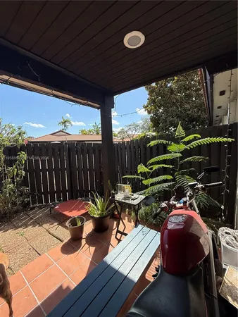 a view of a chairs and tables in patio