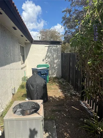 a view of a back yard of the house and a chair
