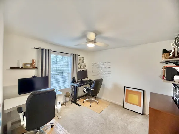 a room with furniture and a flat screen tv