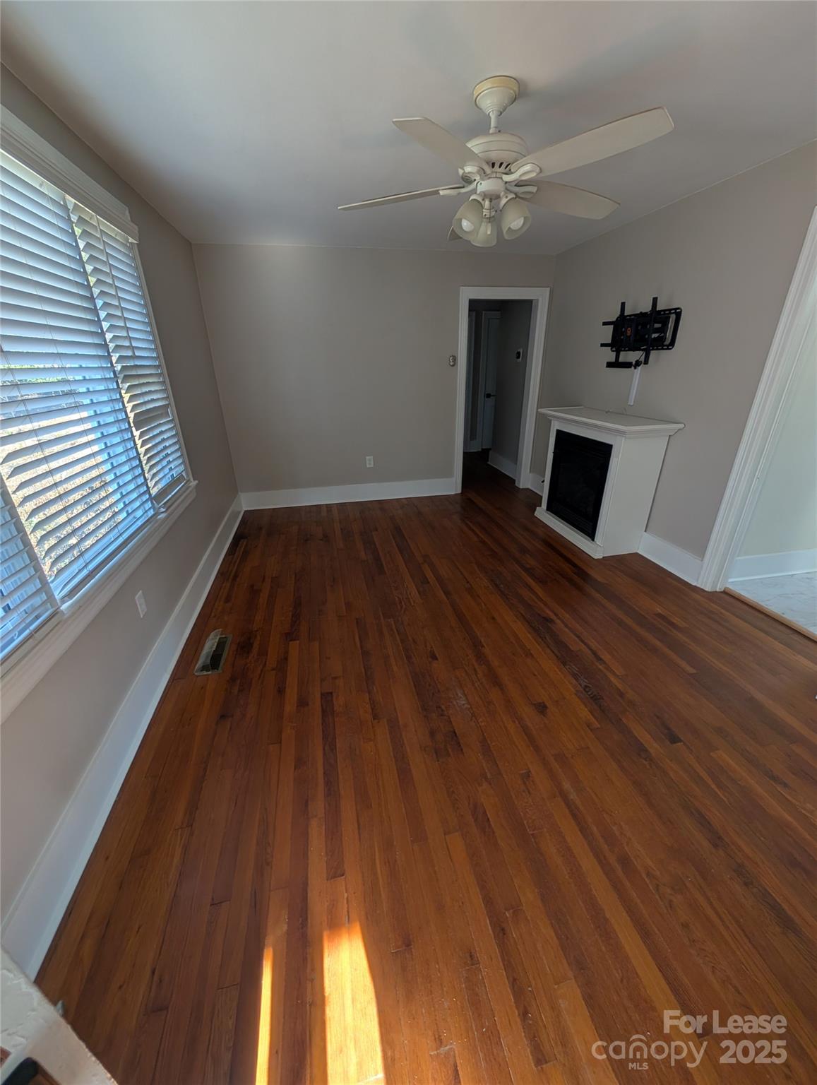 243 Woodland Road Tryon, NC 28782 - Photo 2 of 15 wooden floor in an empty room with a window