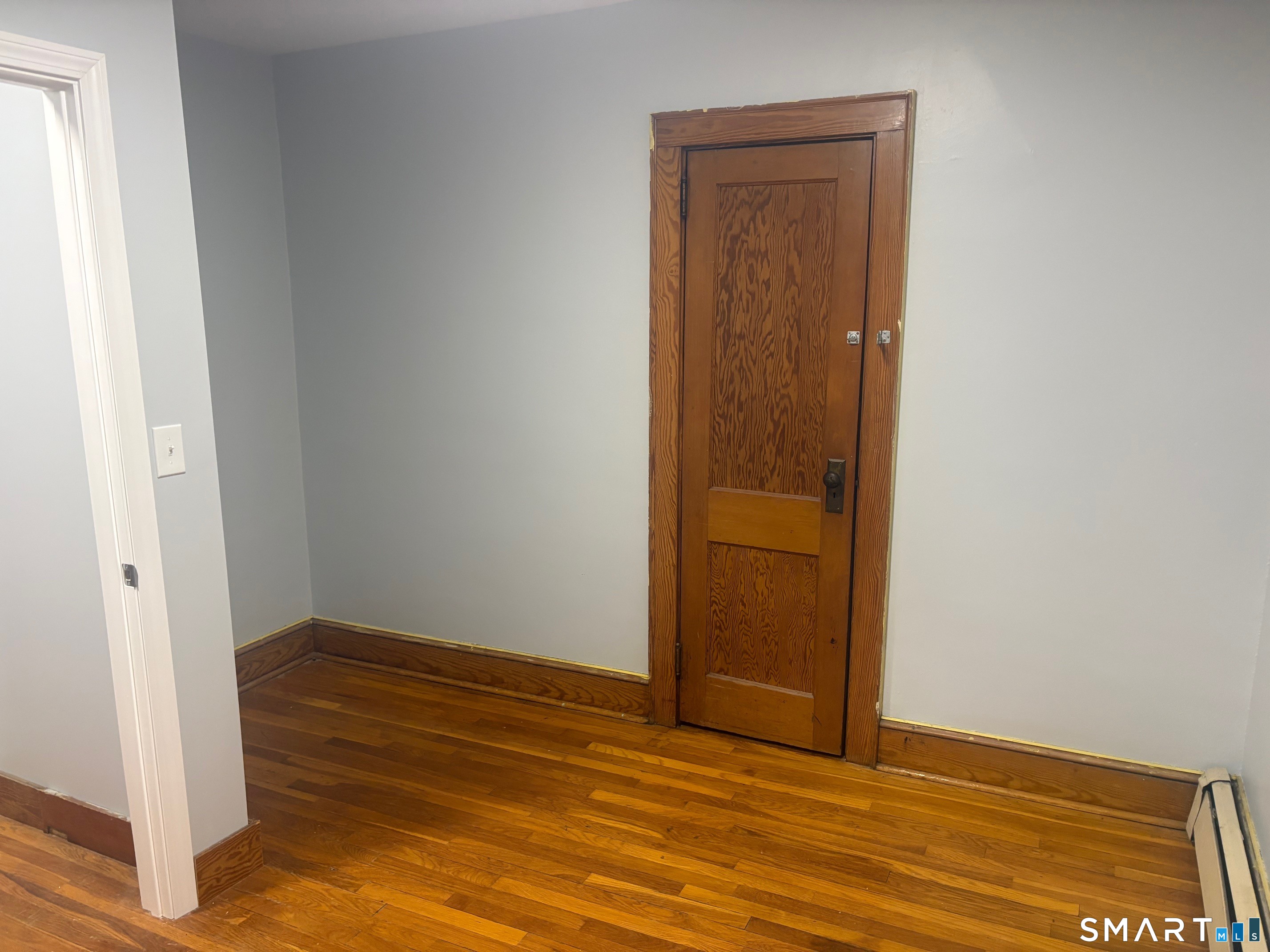580 High Street Middletown, CT 06457 - Photo 11 of 11 an empty room with wooden floor and closet
